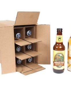 Beer bottle shipper from Spirited Shipper made for and containing six 375 bottles of beer pictured next to two bottles of beer
